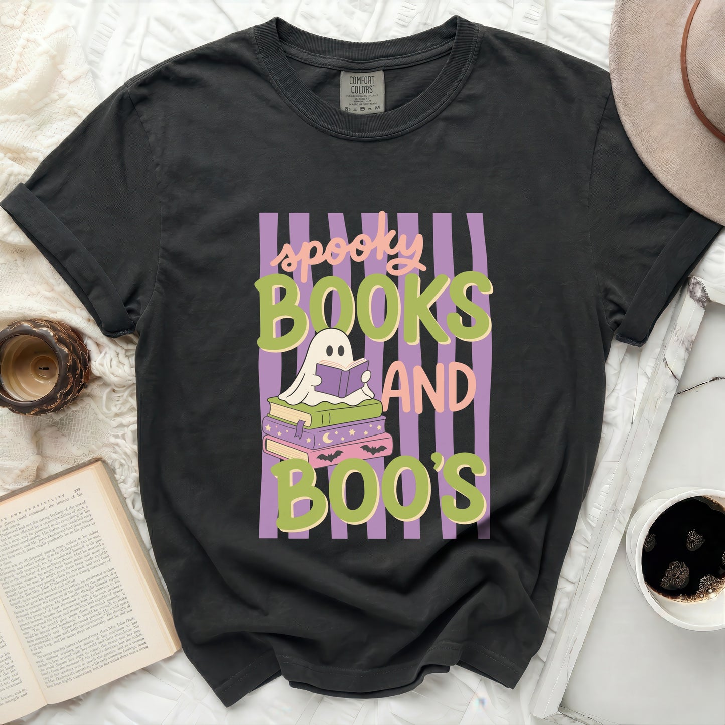 Black t-shirt with "spooky books and boo's" Halloween graphic.