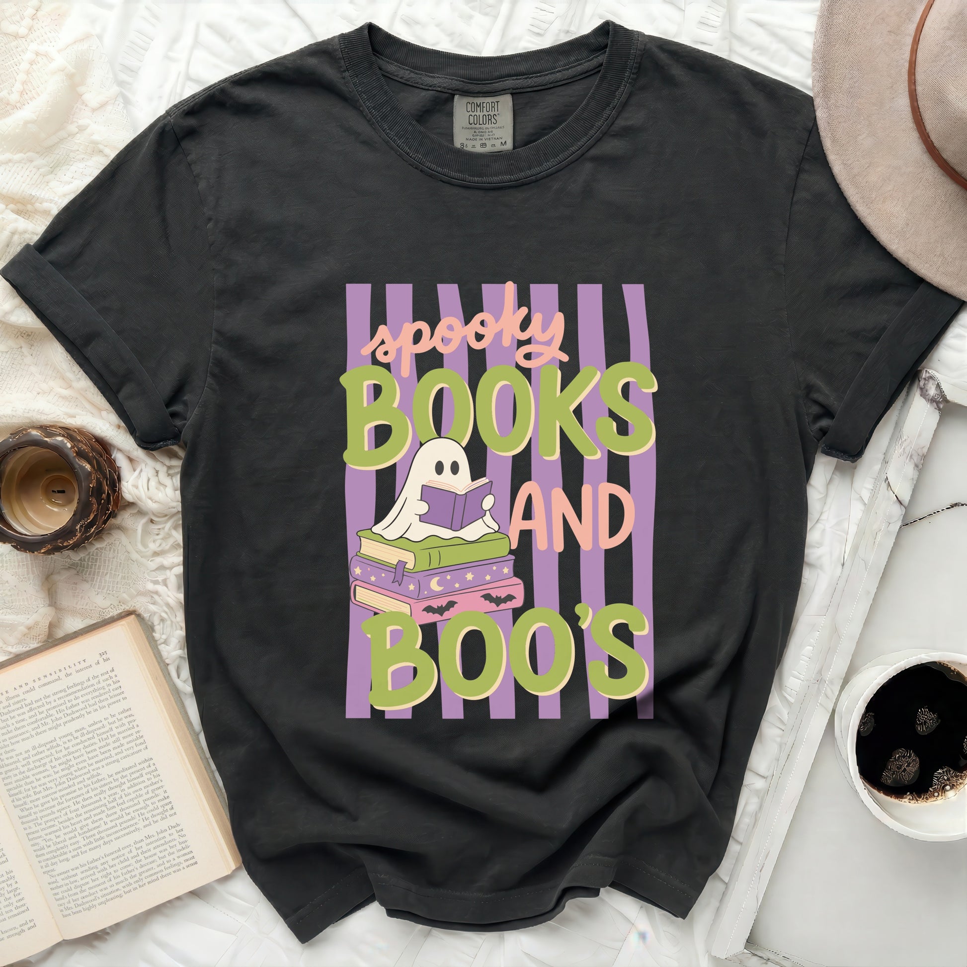 Black t-shirt with "spooky books and boo's" Halloween graphic.