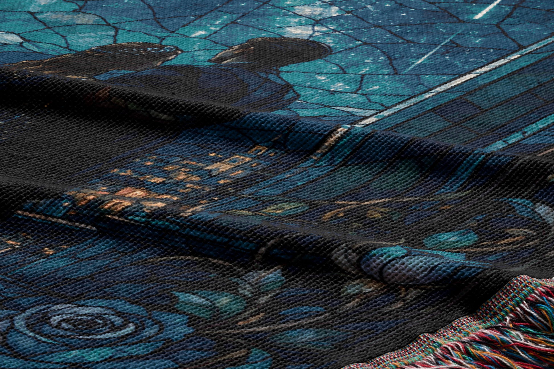 a close-up view of a textured fabric with a floral pattern, including a rose design. The fabric appears to be a dark-colored material with a blue and green color scheme.