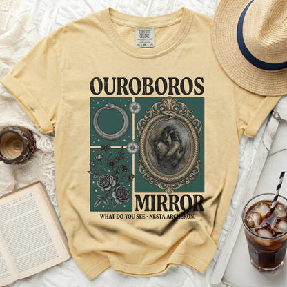 Yellow t-shirt with OUROBOROS MIRROR graphic and text.