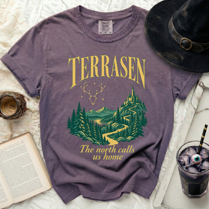 Purple t-shirt with "TERRASEN" and "The north calls us home" text and a castle scene.