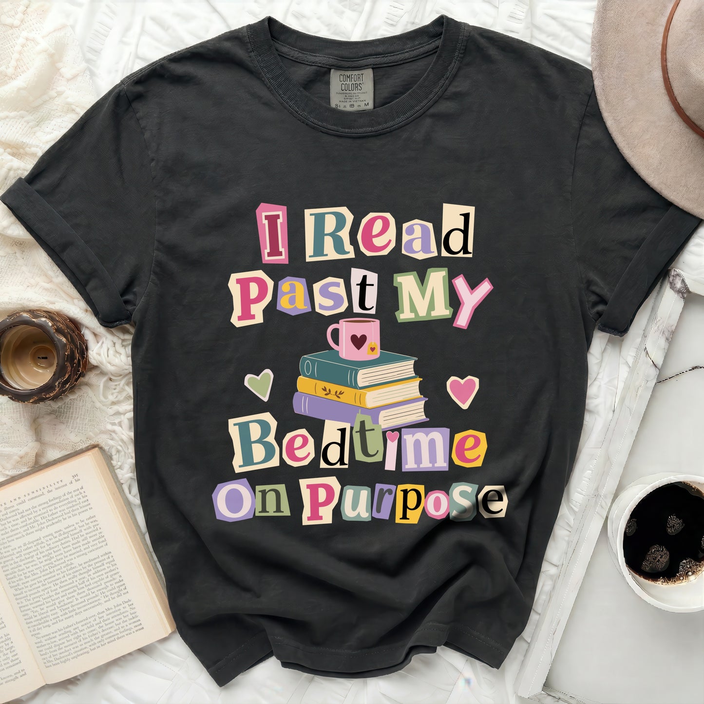 Black t-shirt with "I Read Past My Bedtime On Purpose" graphic.