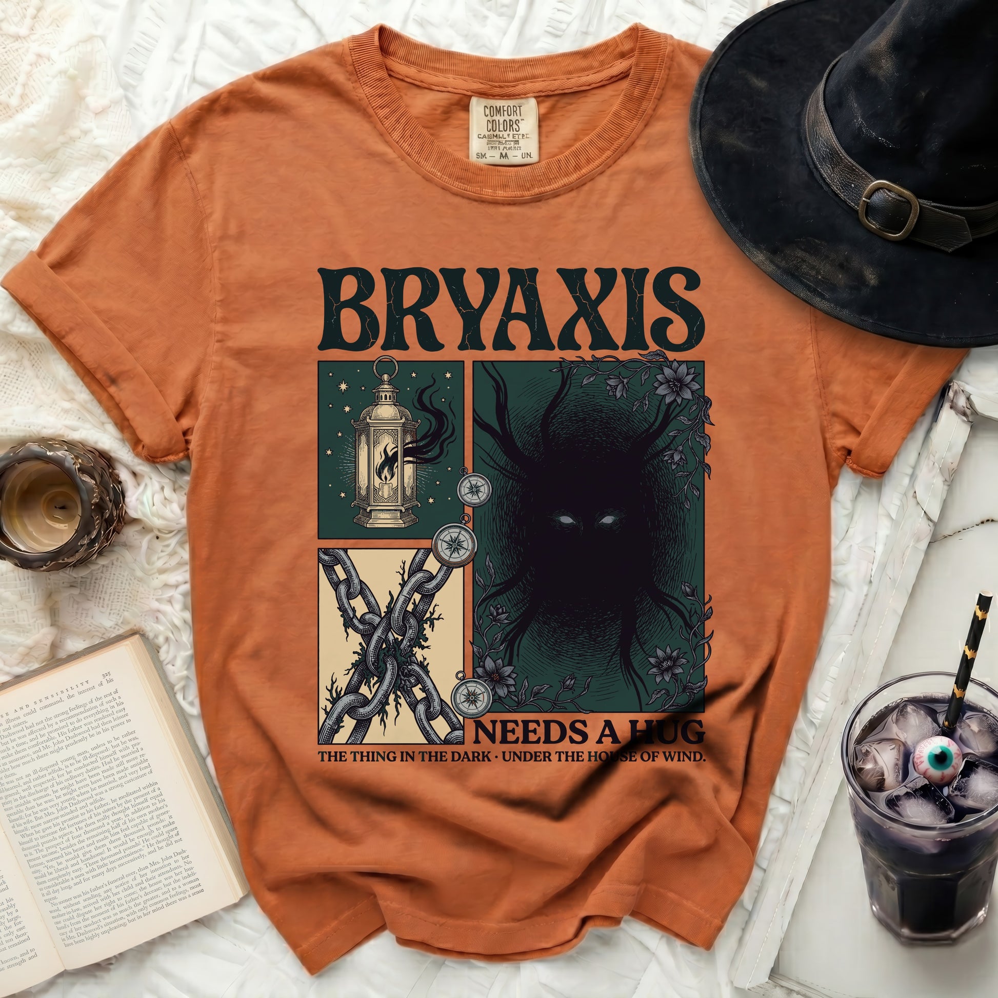 Orange t-shirt with "BRYAXIS NEEDS A HUG" and illustrations.