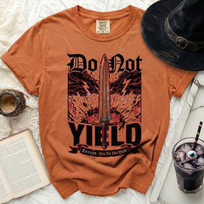 Orange t-shirt with graphic of sword, storm clouds, and text "Do Not YIELD".