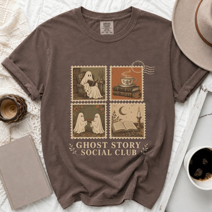 Brown t-shirt with ghost and book motifs and "Ghost Story Social Club" text.
