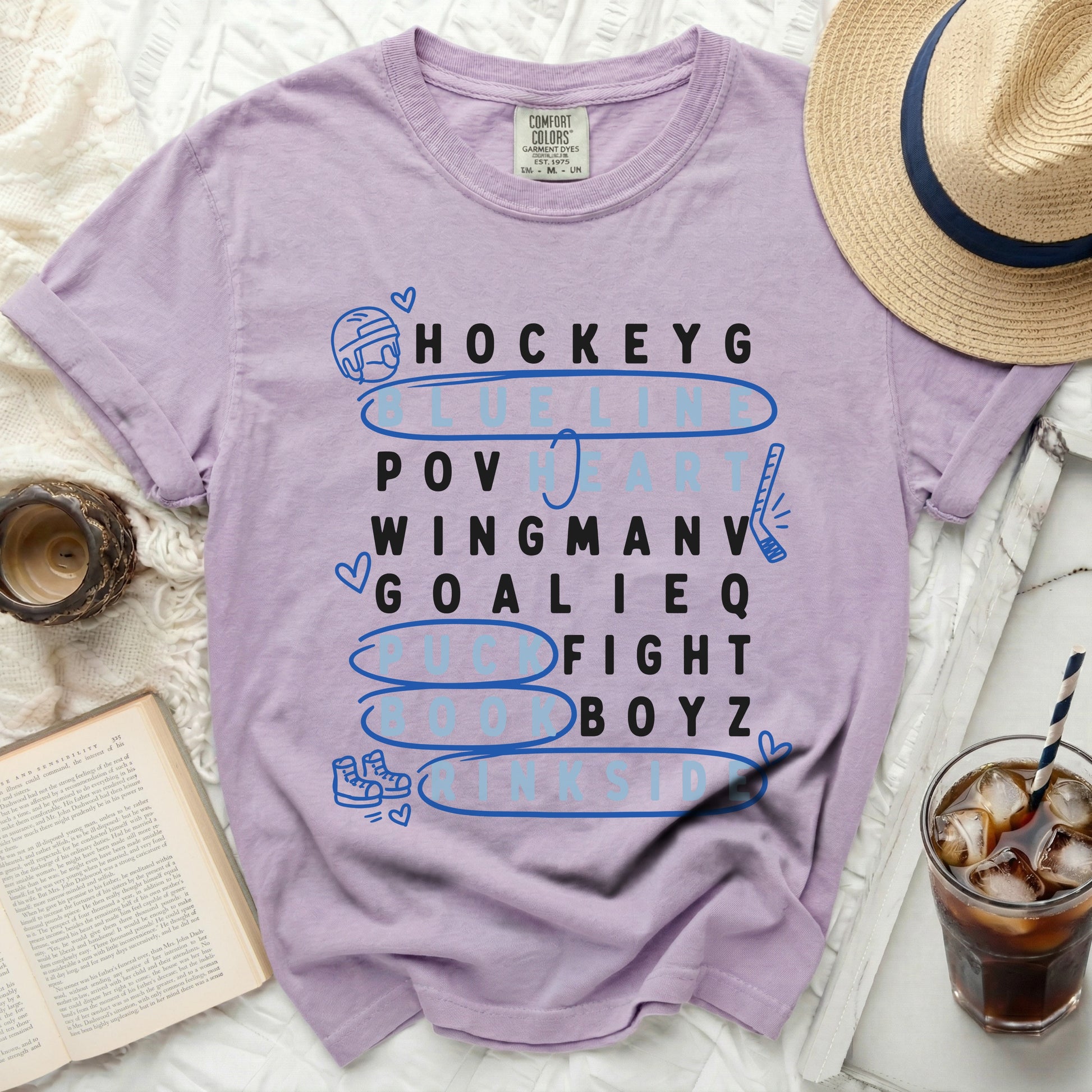 Purple t-shirt with "HOCKEYG POV WINGMANV GOALIEQ FIGHT BOYZ" text.