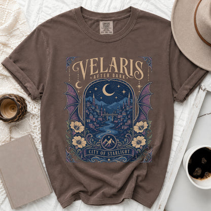 Brown t-shirt with "Velaris After Dark City of Starlight" text and a starry city illustration.