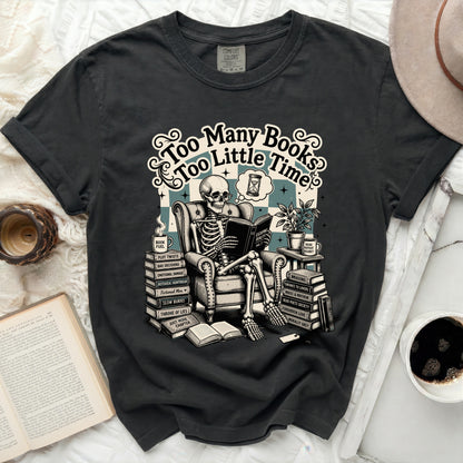 Skeleton reading a book with "Too Many Books Too Little Time" text.