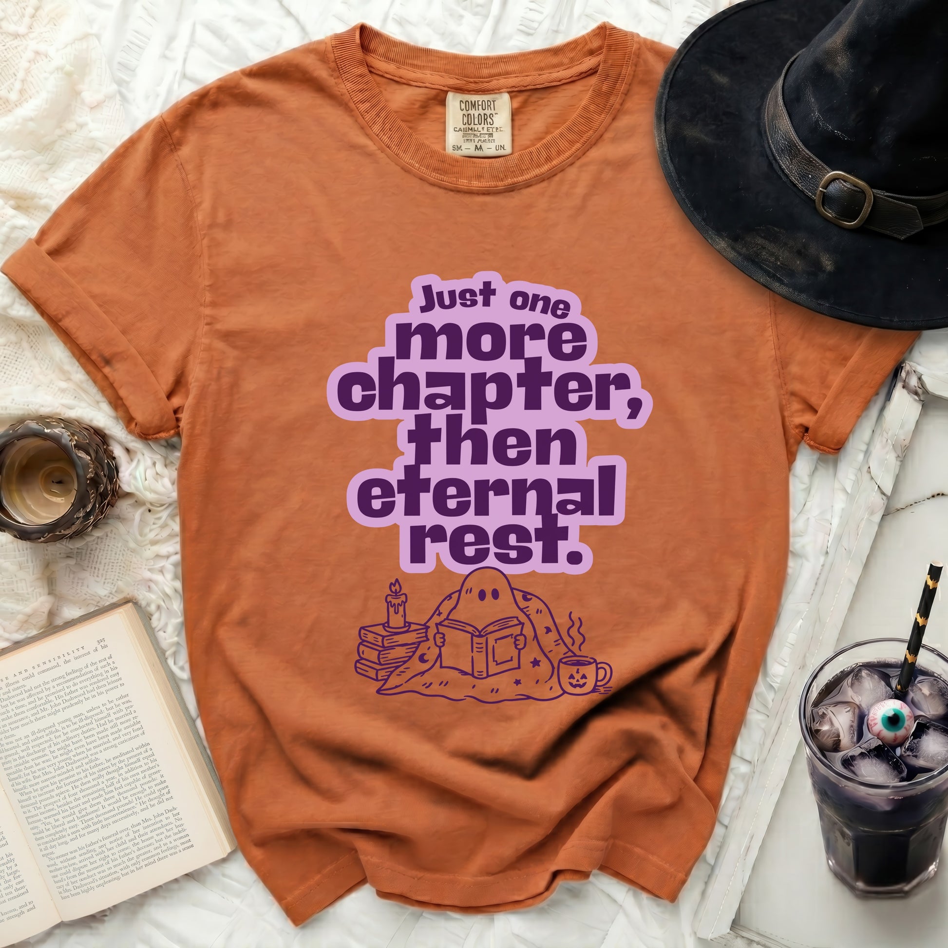 Orange t-shirt with "Just one more chapter, then eternal rest" text and ghost reading.