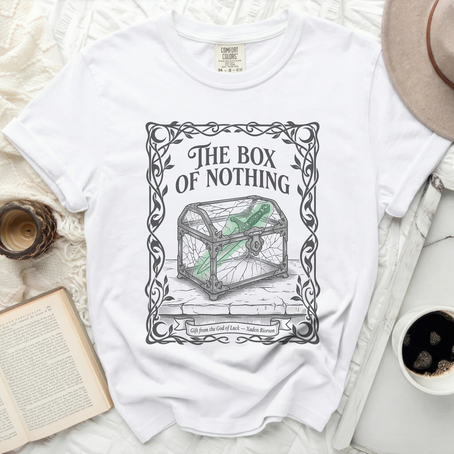 White t-shirt with "The Box of Nothing" title and cracked glass box graphic.