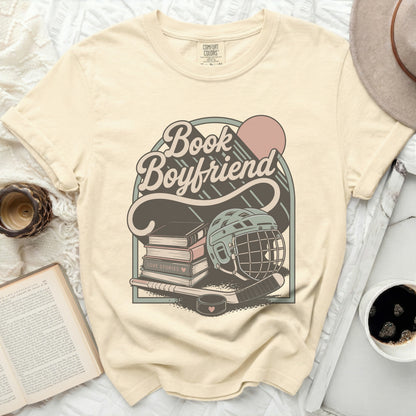 Comfort Colors t-shirt with "Book Boyfriend Love Stories" text and hockey graphic.