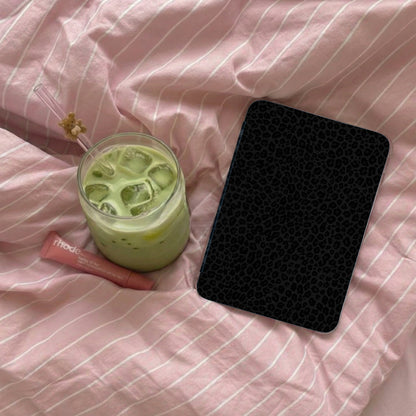 Black leopard print phone case with a matcha latte and lip balm.