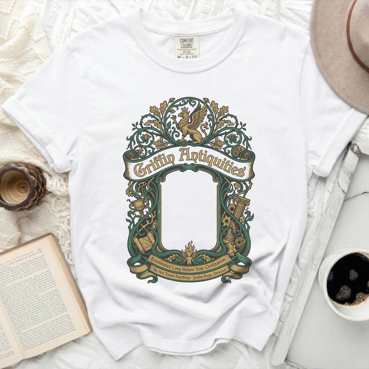 White t-shirt with green Griffin Antiquities logo and text.