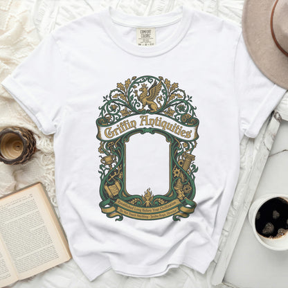 White t-shirt with green Griffin Antiquities logo and text.