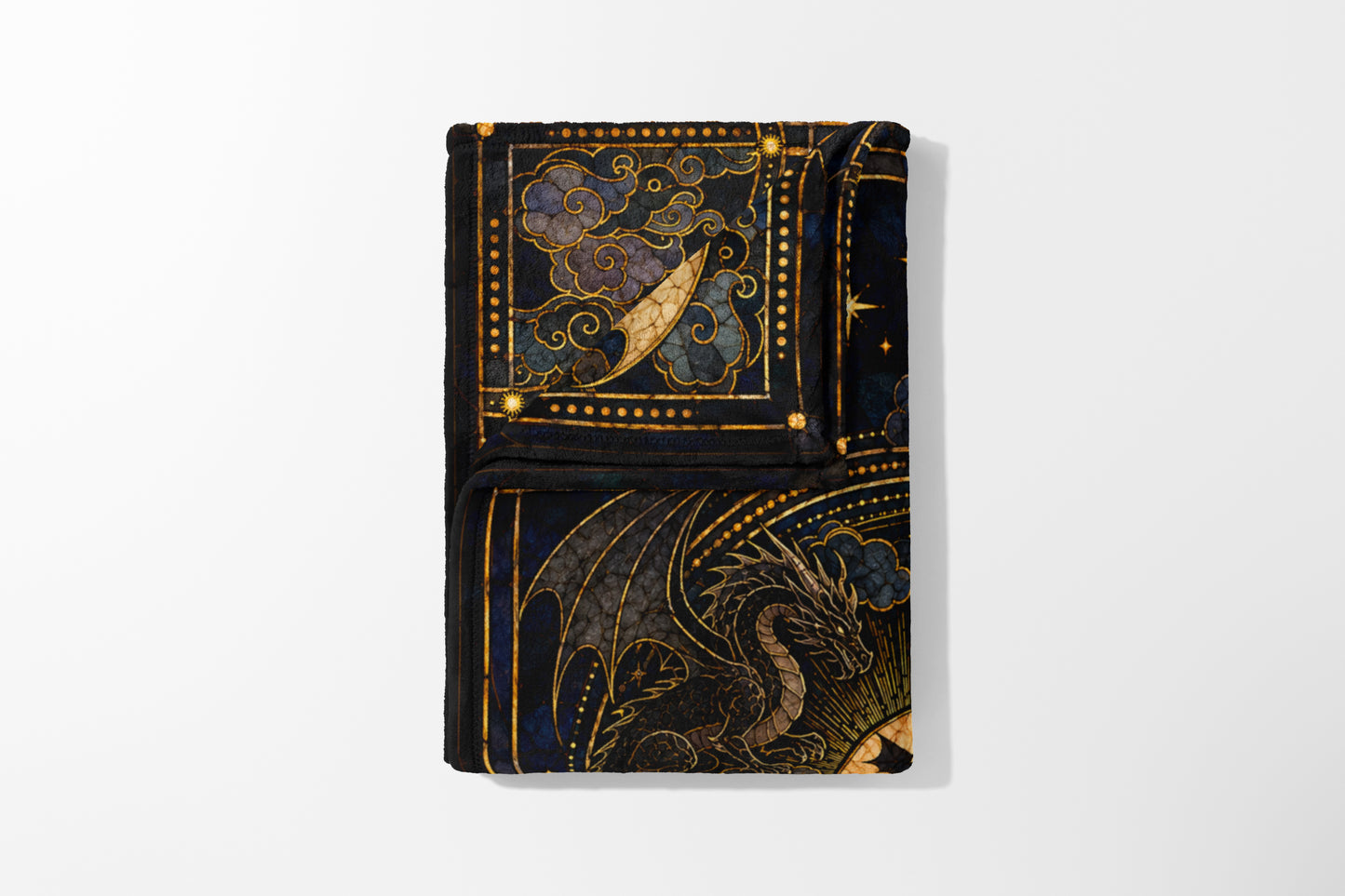 Black blanket with a dragon and celestial design in gold and blue.