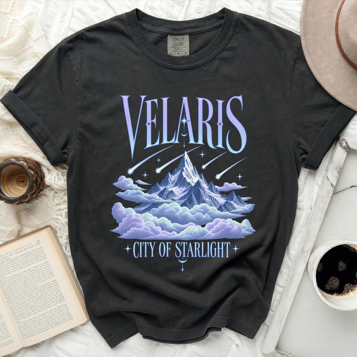 Black t-shirt with "VELARIS CITY OF STARLIGHT" text and a mountain graphic.