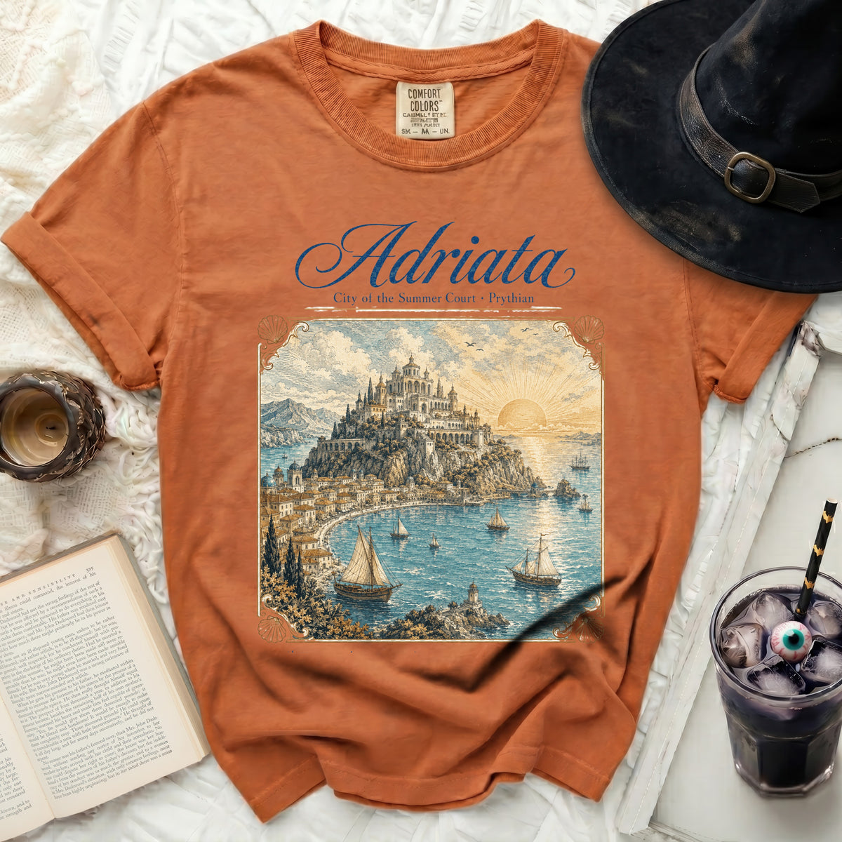 Orange t-shirt with "Adriata City of the Summer Court Prythian" graphic.