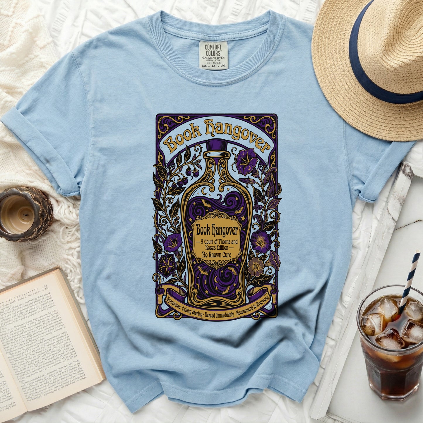 Light blue shirt with "Book Hangover" and flask design.