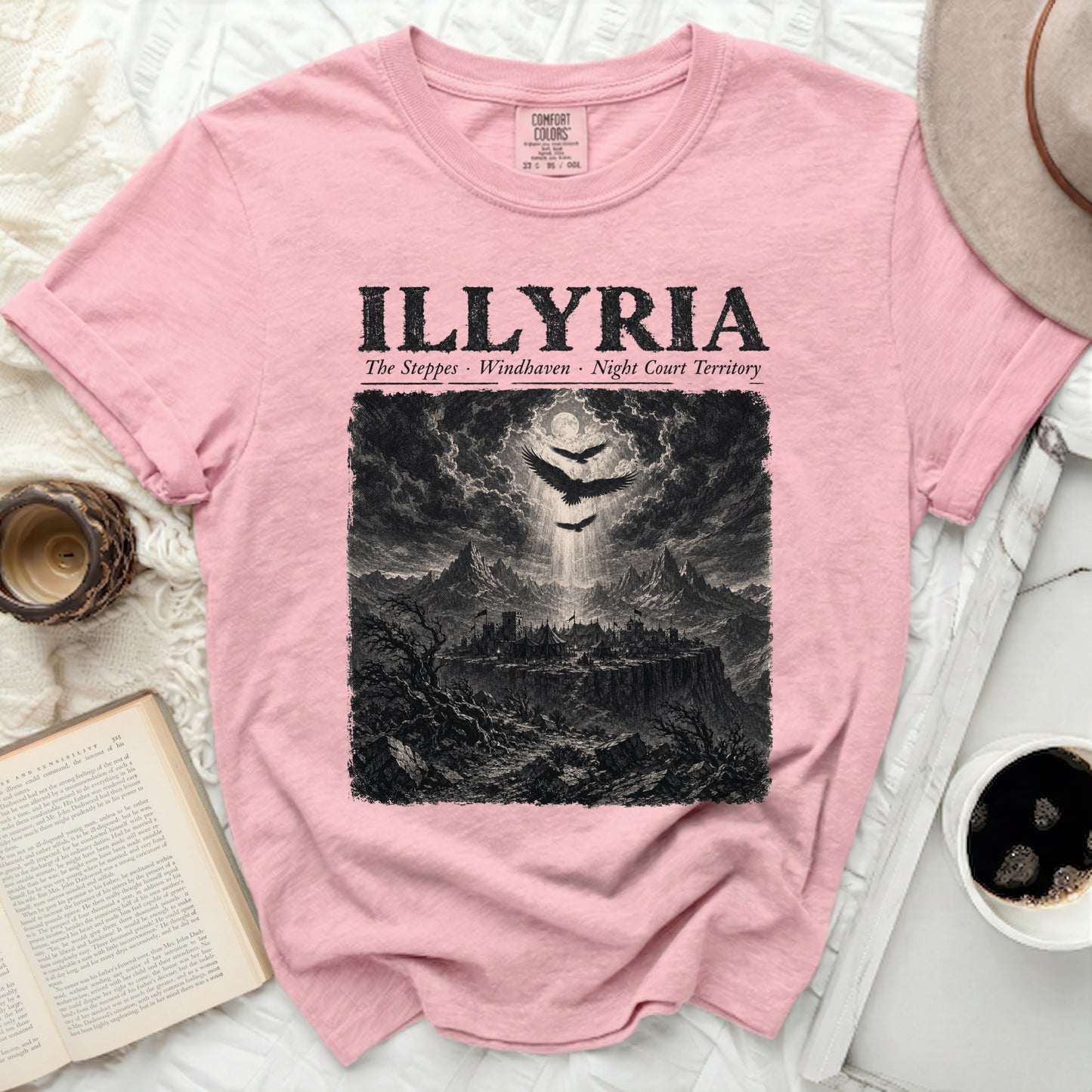 Pink t-shirt with "ILLYRIA" text and a black and white illustration of a fortress.