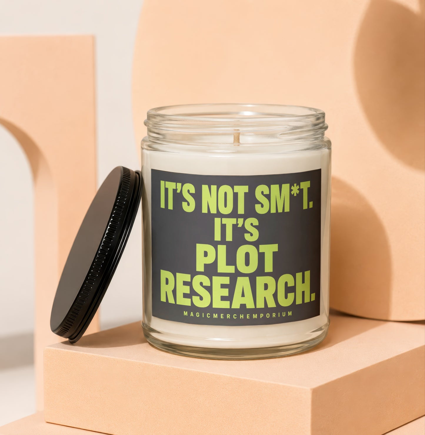 Candle with black lid reads "It's not sm*t. It's plot research."