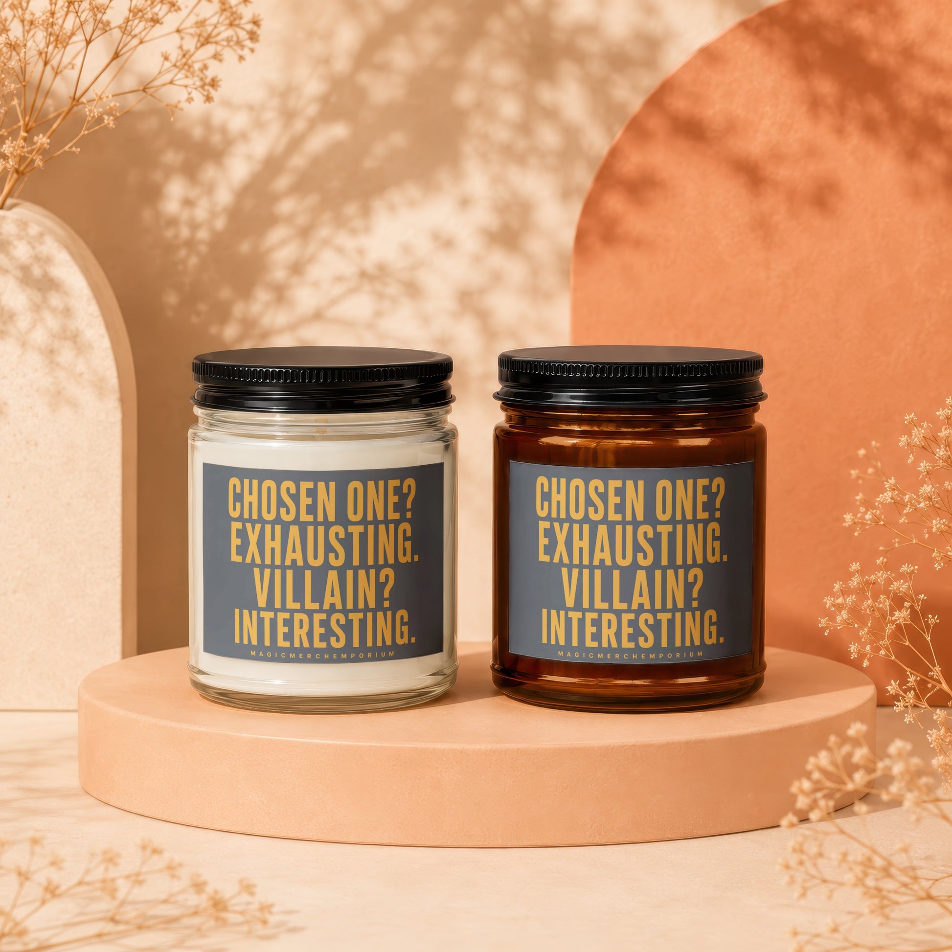 Two candles, one white and one amber, with labels reading "CHOSEN ONE? EXHAUSTING. VILLAIN? INTERESTING."