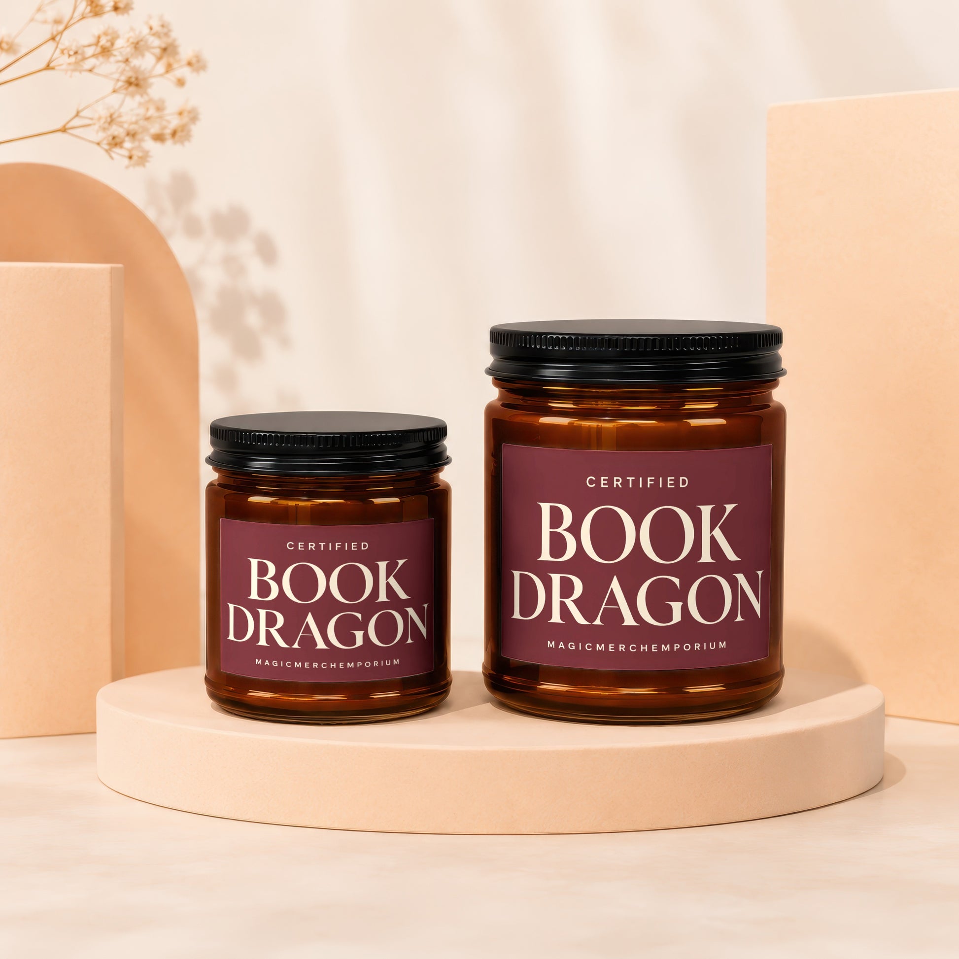 Amber jar candles with "Certified Book Dragon" labels on display stands.