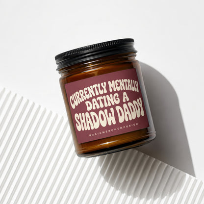 Glass candle with "Currently Mentally Dating A Shadow Daddy" text on label.