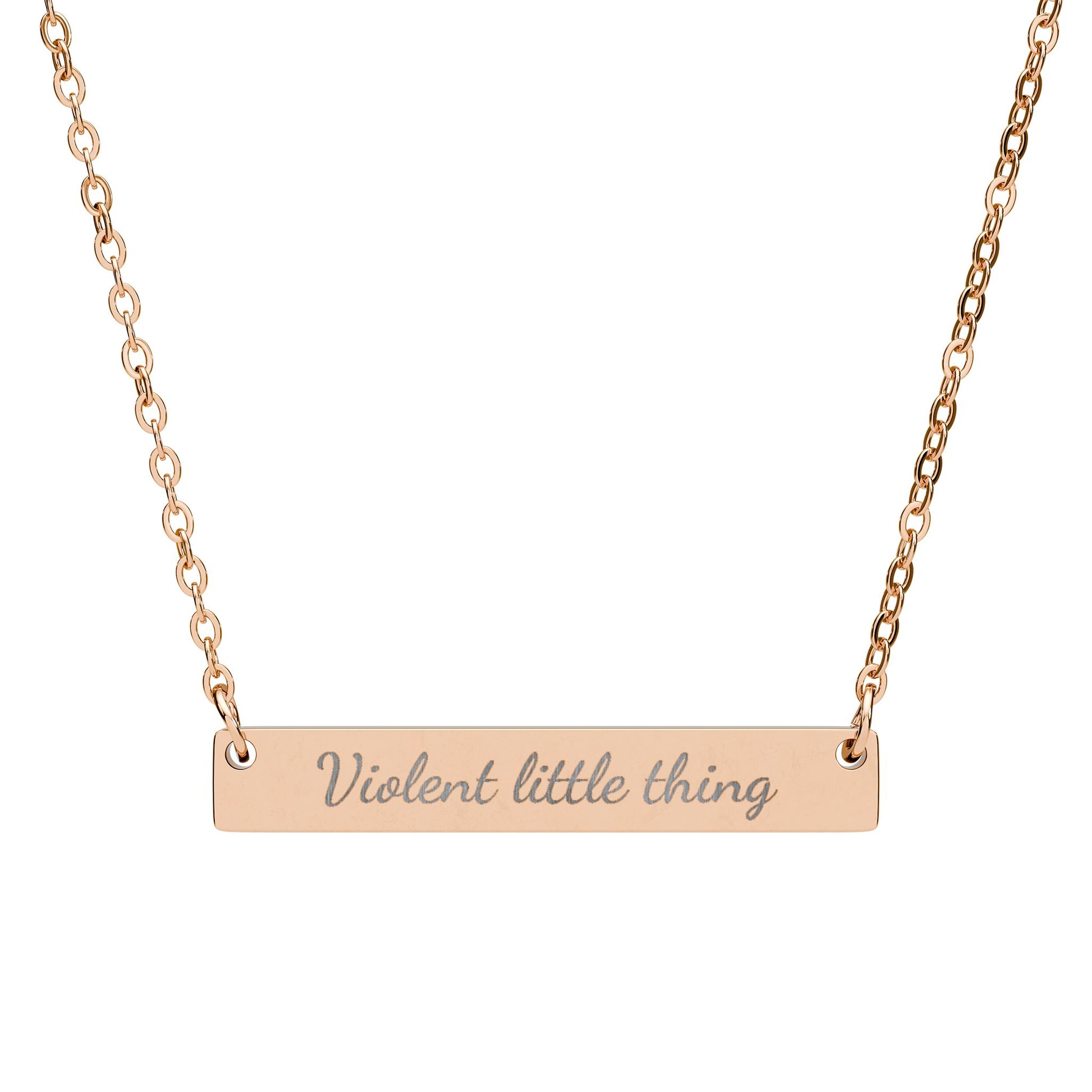 Rose gold bar necklace with "Violent little thing" engraved.