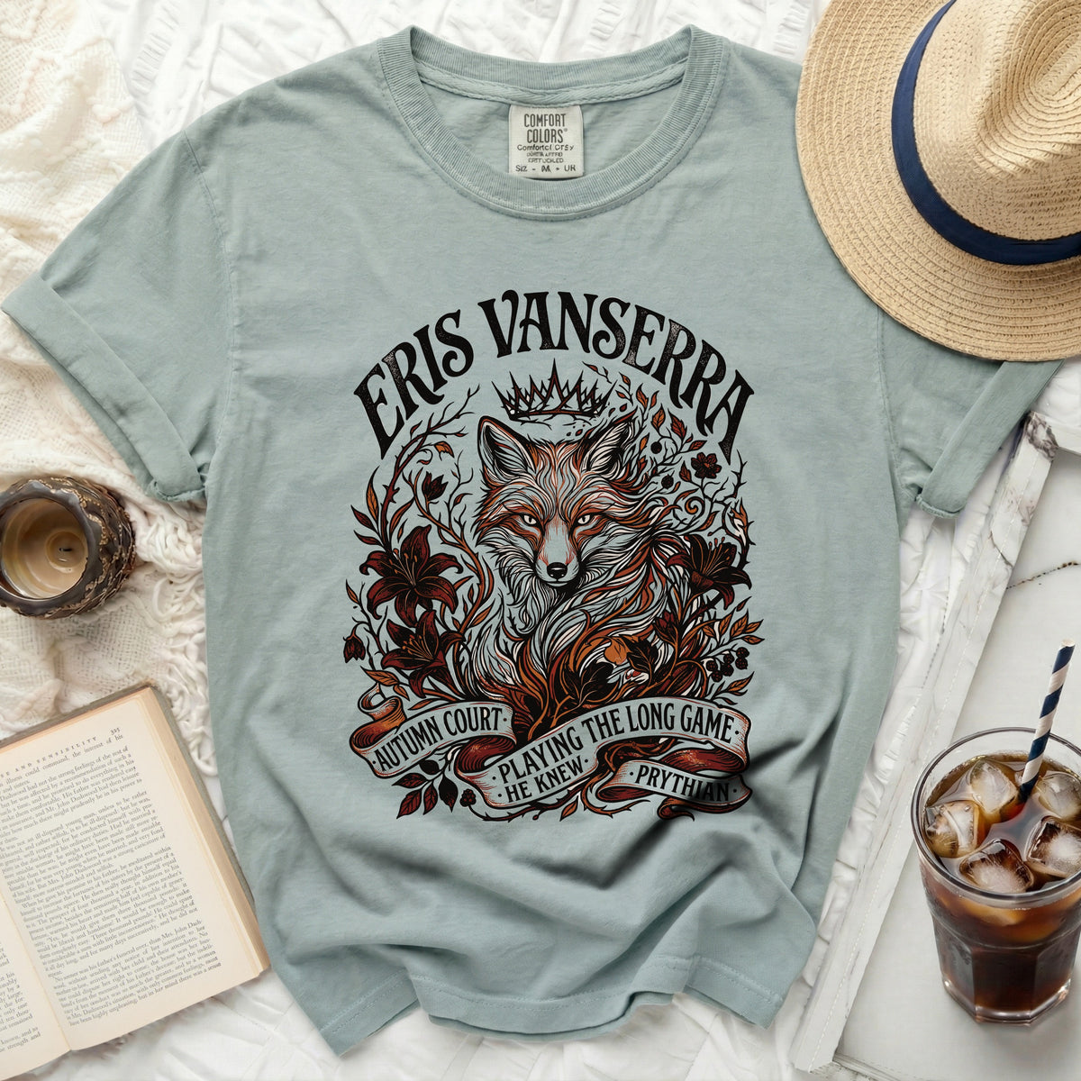 Light blue t-shirt with a distressed graphic of a fox, crown, and text.