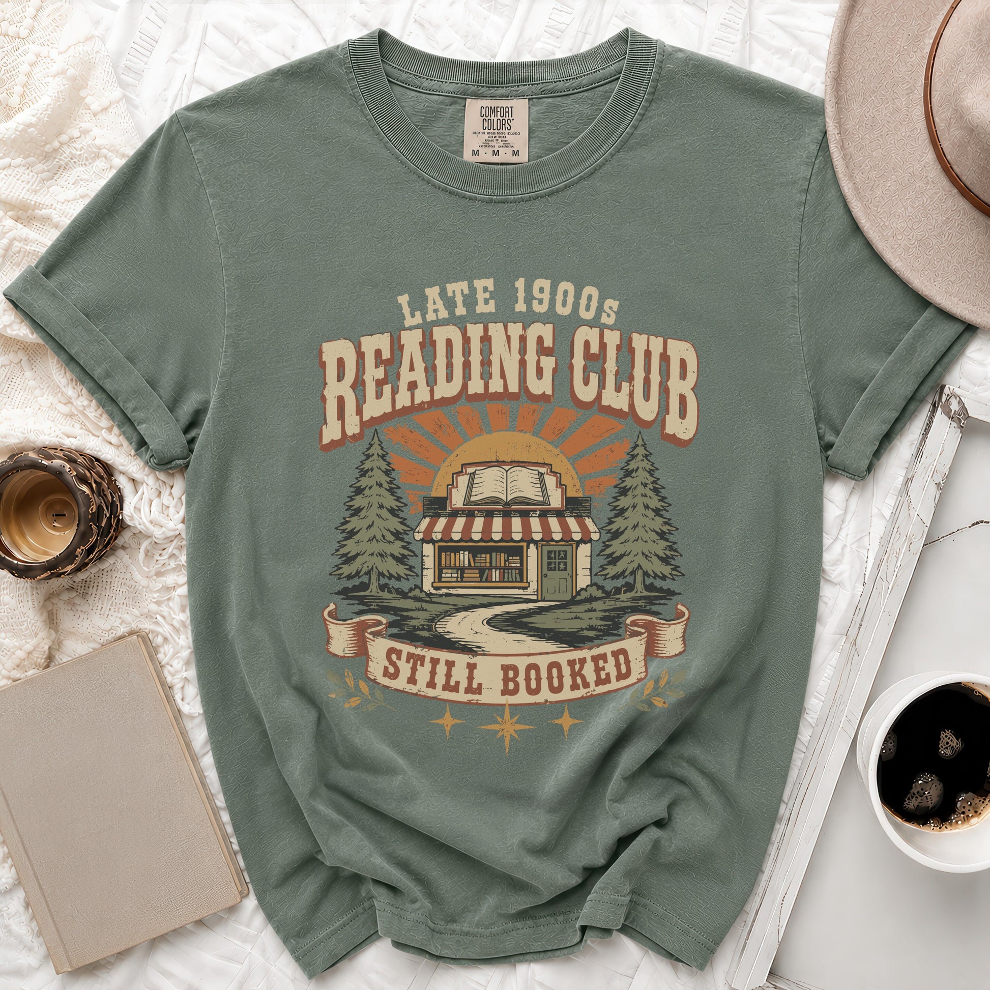 T-shirt with "Late 1900s Reading Club Still Booked" graphic and bookstore illustration.