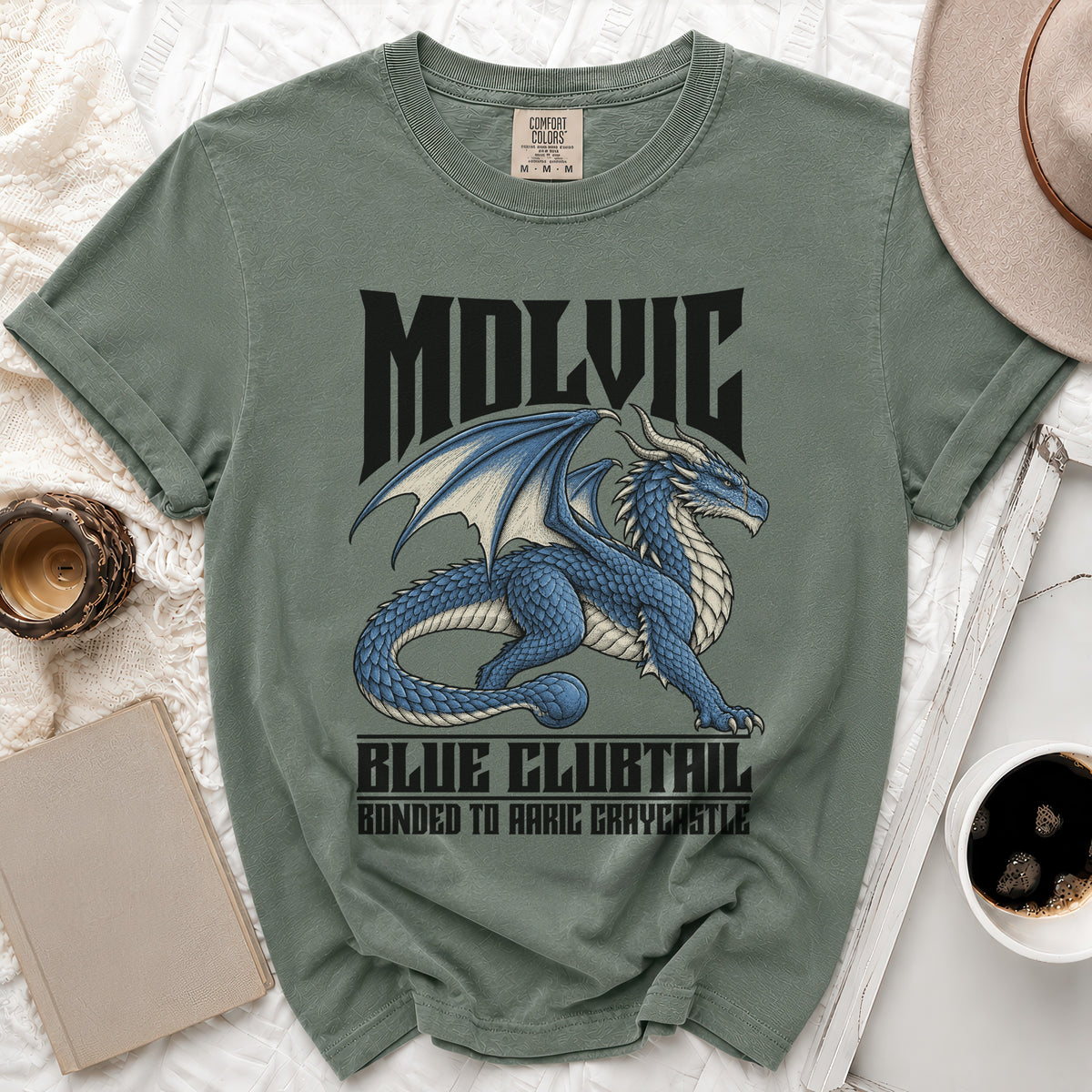 Green t-shirt with a blue dragon graphic and text "MOLVIC BLUE CLUBTAIL BONDED TO AARIC GRAYCASTLE".