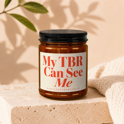 Brown glass candle with red text "My TBR Can See Me" includes brand name.