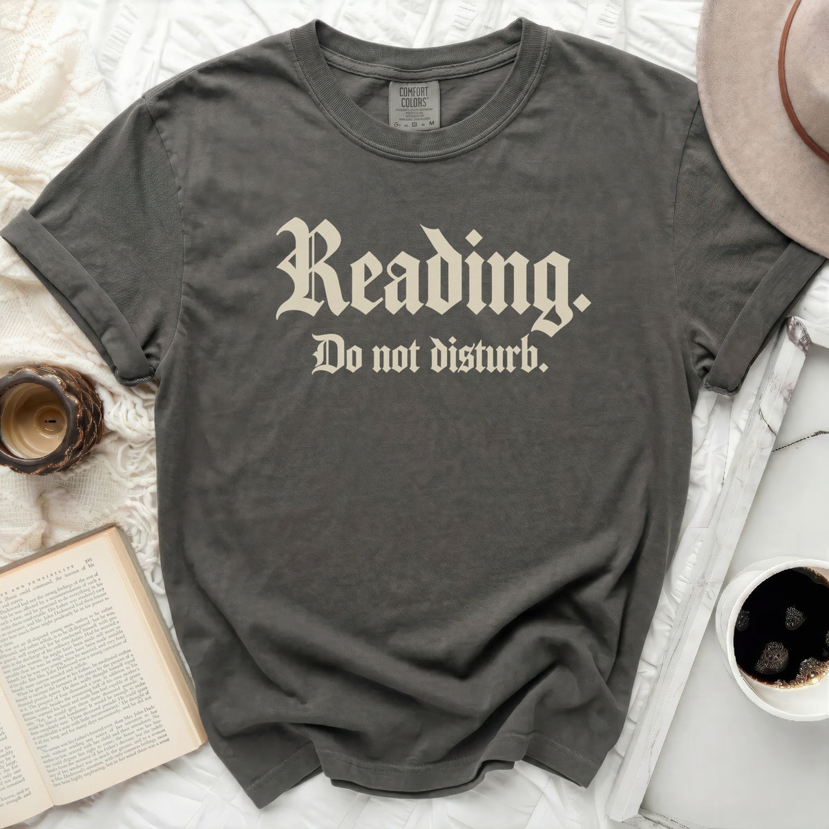 Dark grey t-shirt with "Reading. Do not disturb." text.