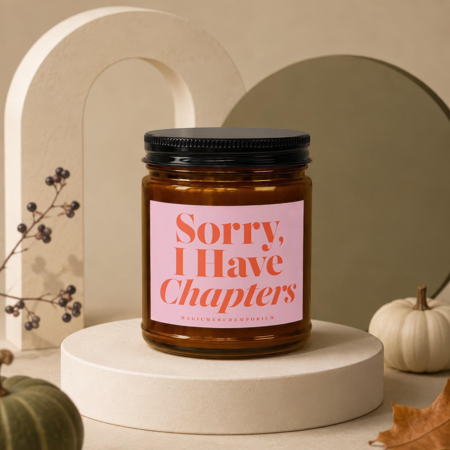 Candle jar with pink label reading "Sorry, I Have Chapters".