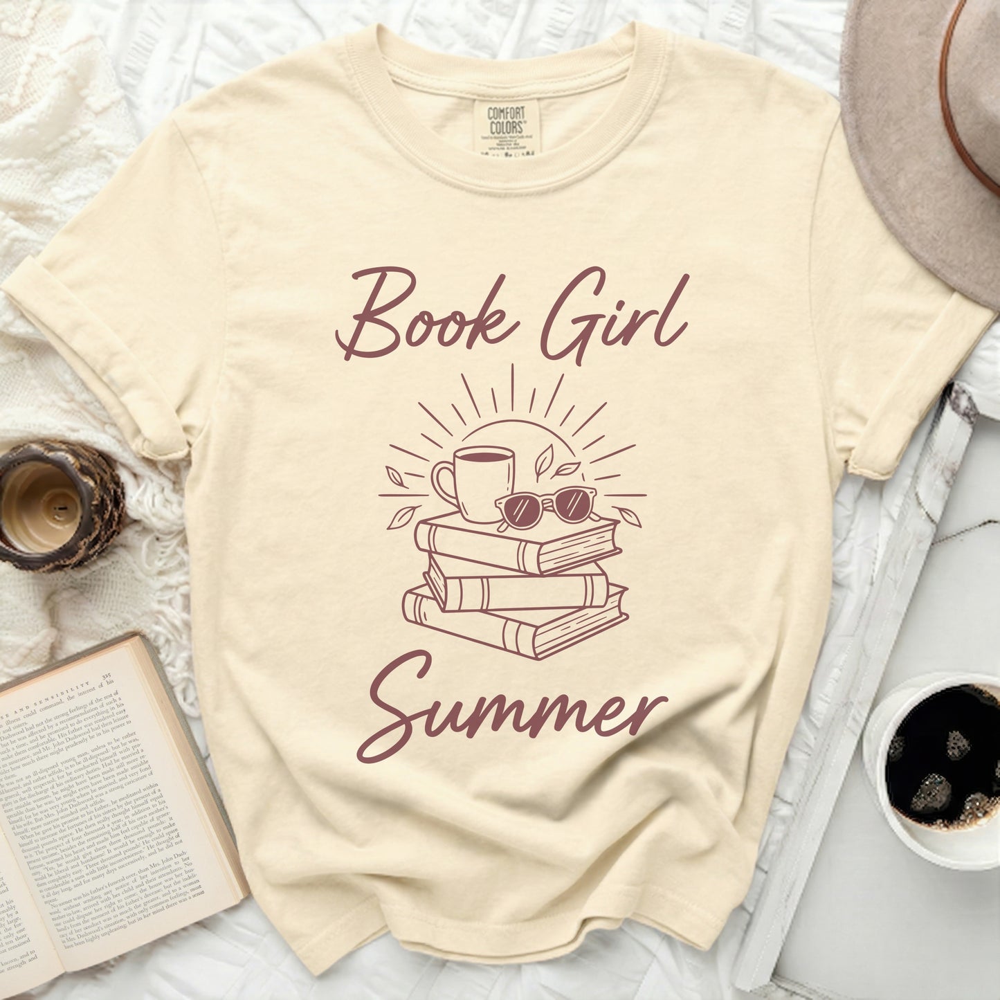 Cream t-shirt with "Book Girl Summer" text and stack of books graphic.