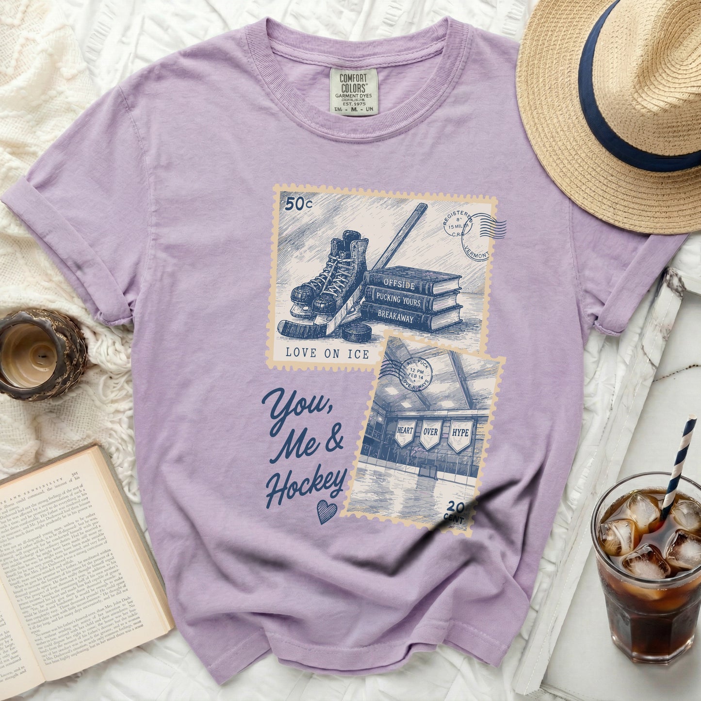 Purple t-shirt with "You, Me & Hockey" and hockey images.