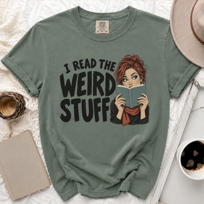 Green t-shirt with graphic text "I READ THE WEIRD STUFF" and a woman reading a book.