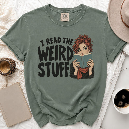 Green t-shirt with graphic text "I READ THE WEIRD STUFF" and a woman reading a book.