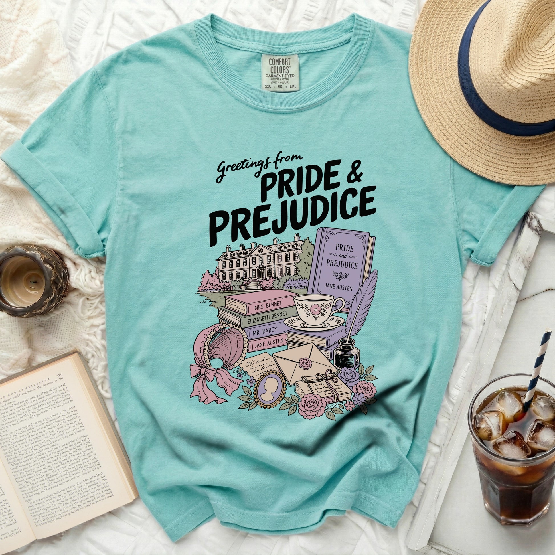 Teal t-shirt with Pride and Prejudice illustration, books, and teacup.