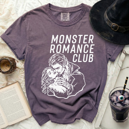 Purple t-shirt with "MONSTER ROMANCE CLUB" and vampire couple graphic.