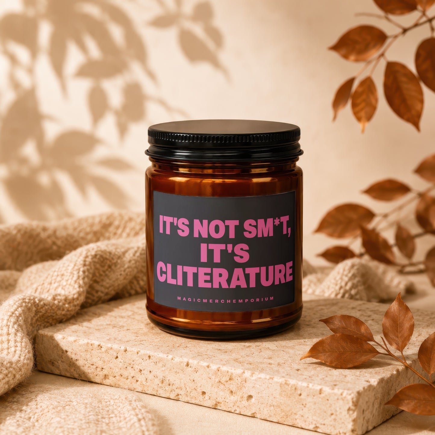 Amber jar candle with pink text "IT'S NOT SM*T, IT'S CLITERATURE" and "MAGICMERCHEMPORIUM".
