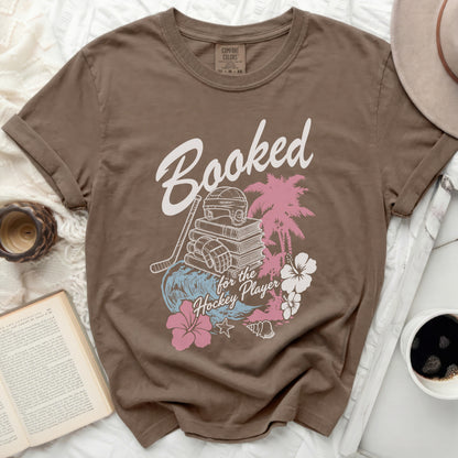 T-shirt with "Booked for the Hockey Player" text and hockey graphics.