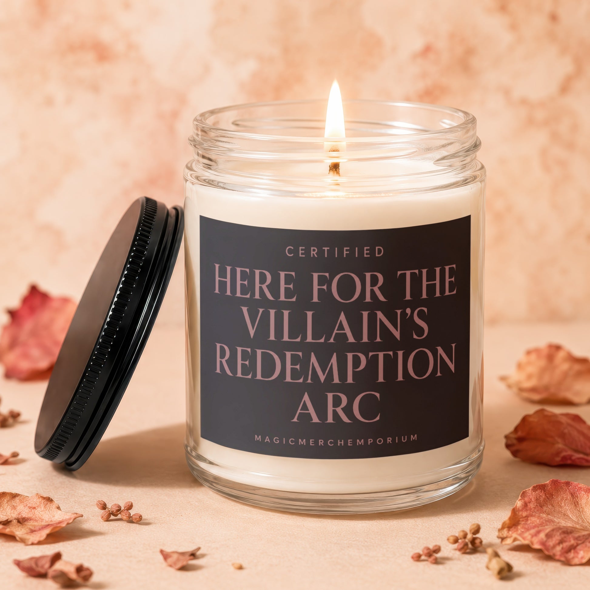 Candle with lid off, lit wick, and text "CERTIFIED HERE FOR THE VILLAIN'S REDEMPTION ARC".
