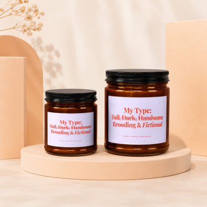 Two amber glass jars with black lids, featuring labels with red text: "My Type: Tall, Dark, Handsome Brooding & Fictional."