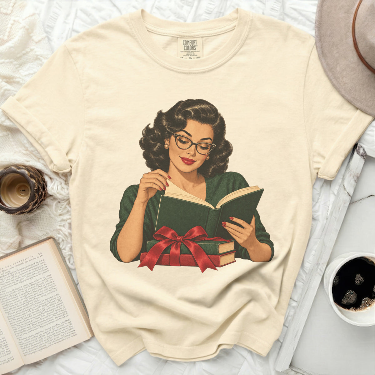 Cream t-shirt with a vintage illustration of a woman reading a book.