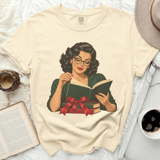 Cream t-shirt with a vintage illustration of a woman reading a book.