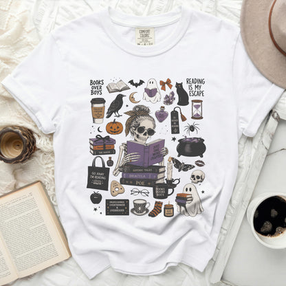 White t-shirt with Halloween-themed book and reading graphics