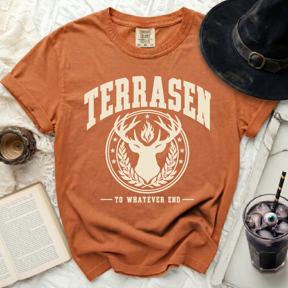 Orange t-shirt with "TERRASEN" and deer graphic, "TO WHATEVER END."