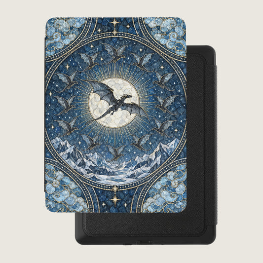 Kindle e-reader in a blue case decorated with a mosaic design of dragons flying before a full moon.