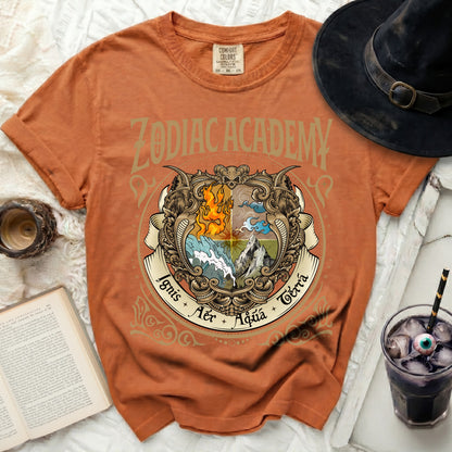 Orange t-shirt with "ZODIAC ACADEMY" and elemental crest with "Ignis Aer Aqua Terra".